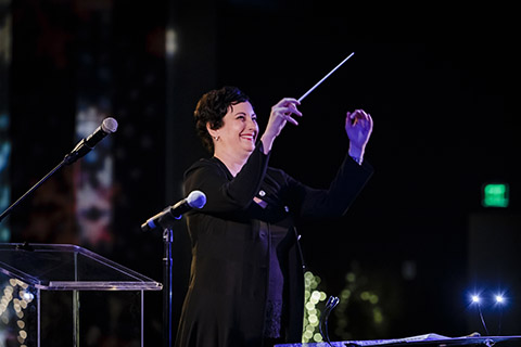 Frost School of Music's faculty member, Karen Kennedy, conducting during a performance
